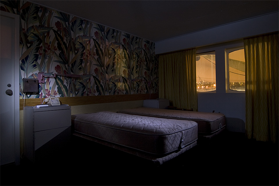 Bedside  :::::  One of hundreds of staterooms.